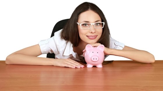 Girl With Piggy Bank